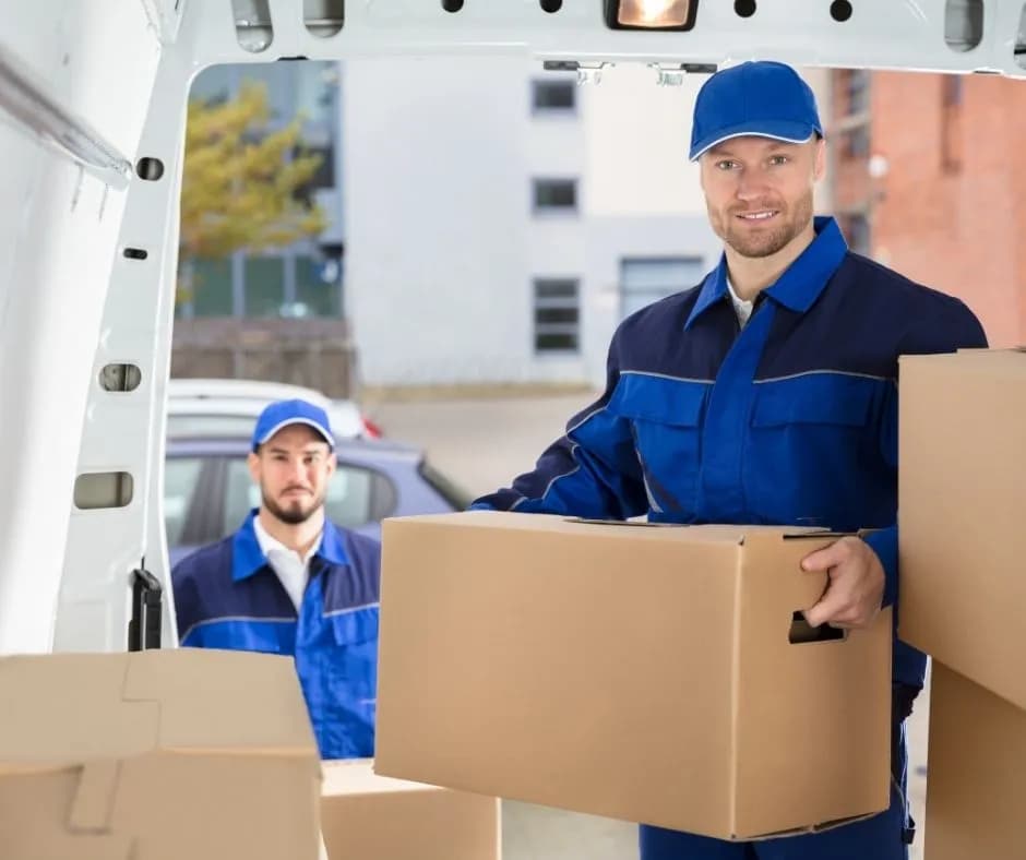 Moving truck being loaded with furniture