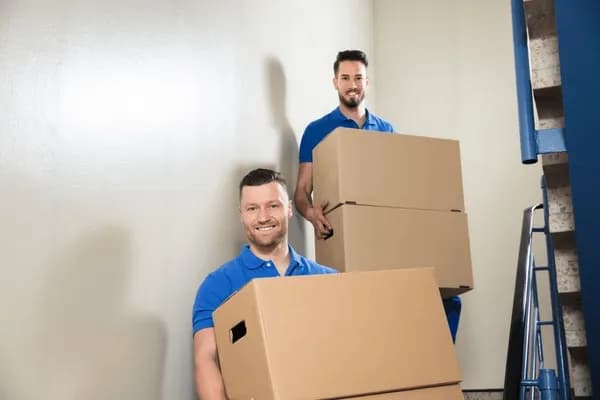 Professional movers carefully packing items